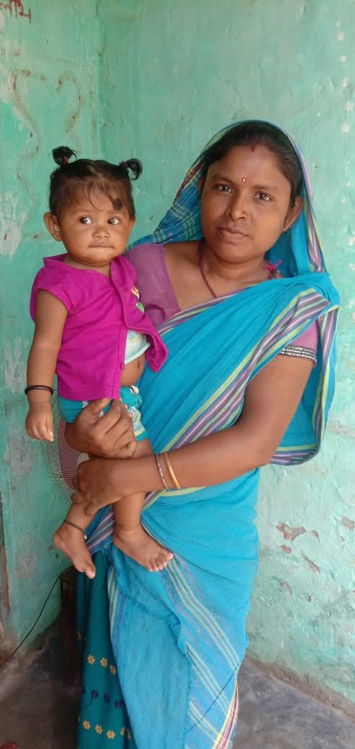 Purnima Tanti with her daughter, who was delivered safely at a government hospital after receiving support through the Improving Lives programme. Image: UNICEF.